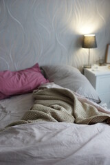 Bed with duvet and blanket in the bedroom
