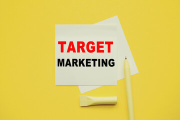 TARGET MARKETING. Word on YELLOW sticker with YELLOW pen and yellow background. a bright solution for business, financial, marketing concept