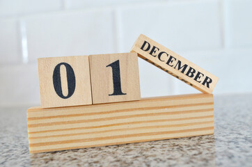 December 1, Cover design with number cube on a white background and granite table.