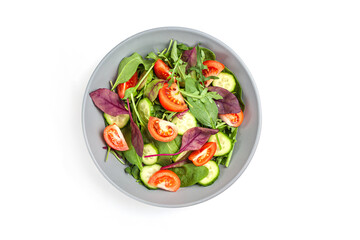 Healthy fresh salad of vegetable cucumber, tomato, spinach, arugula