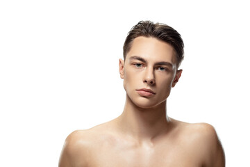Serious. Portrait of young man isolated on white studio background. Caucasian attractive male...