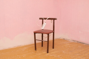 an old chair in a dirty room without renovation