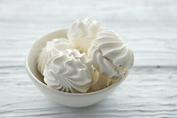 Zephyr in a ceramic bowl on a white wooden background