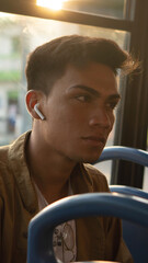 Latino passenger using public transportation to go to work, while looking around, on and off the bus © Patricio