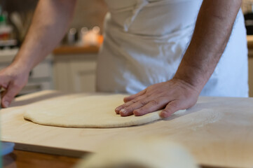 Preparing bread for fried gnocco, one of the best food of the Emilian cuisine