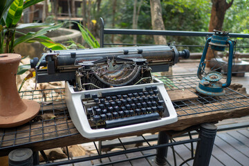 
The old typewriter on the wooden table