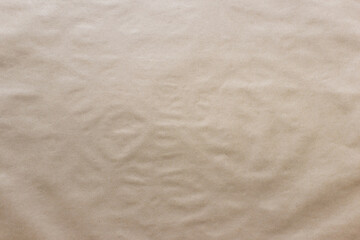 Textured uneven kraft paper background with uneven surface.