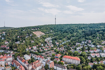 Obraz premium Aerial drone shot of TV tower on the hill near Stuttgart suburb hill