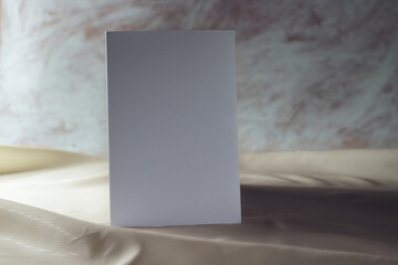Business card on rustic background. Empty white poster, paper, corporate identity or card mockup with shadows.
