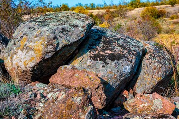 Huge deposits of stone minerals in a clearing bathed in warm sun in picturesque Ukraine