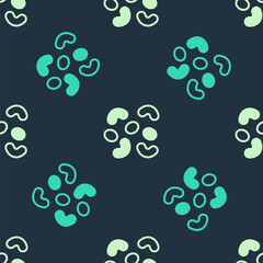 Green and beige Jelly candy icon isolated seamless pattern on blue background. Vector.
