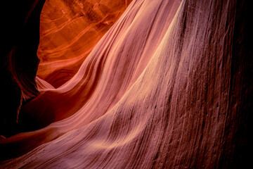 Red sandstone textures of Antelope Canyon, the most-visited and most photographed slot canyon in the American Southwest located on Navajo land near Page, Arizona, USA. 