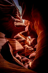 Red sandstone textures of Antelope Canyon, the most-visited and most photographed slot canyon in the American Southwest located on Navajo land near Page, Arizona, USA. 