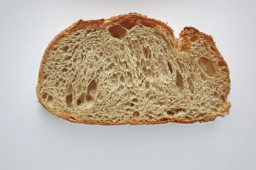 a slice of bread on white backgound. textured bread                    