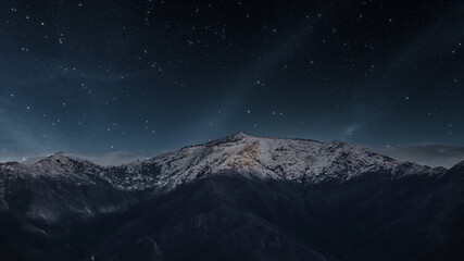 starry night sky over mountain