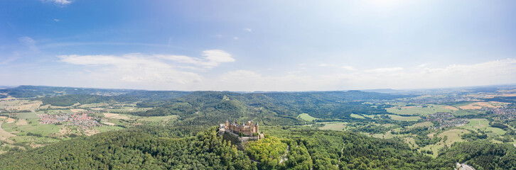 Fototapeta na wymiar Panoramic Aerial view of Medival Hohenzollern Castle on hill near Stuttgart at summer noon