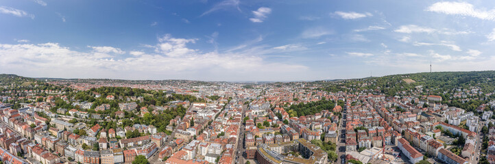 Fototapeta na wymiar Panoramic view of Stuttgart suburb near hills in Germany at summer noon