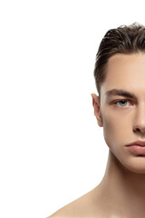 Half-face. Portrait of young man isolated on white studio background. Caucasian attractive male...