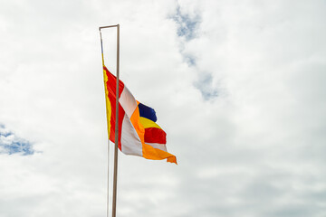 Big buddhist prayer flag outside a temple or pagoda in Vietnam.