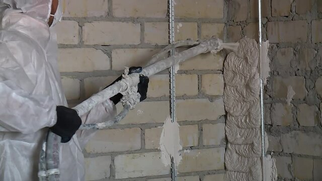 automated plastering of walls. spray solution closeup
