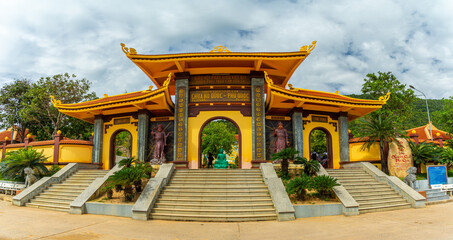 Wide angle view of Ho Quoc pagoda (Vietnamese name is Truc Lam Thien Vien) with big statue of...