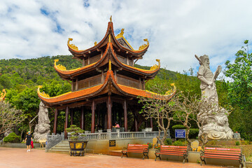 Naklejka premium Wide angle view of Ho Quoc pagoda (Vietnamese name is Truc Lam Thien Vien) with big statue of guanyin bodhisattva on mount, Phu Quoc island, Vietnam