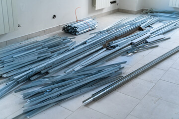Stack bend metal pipeline on floor. Reconstruction of a building. New communications in apartment.