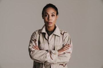 Fototapeta premium Confident african american soldier woman posing with arms crossed