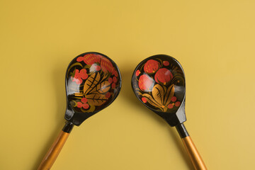 Traditional Russian drawing of khokhloma on wooden spoons