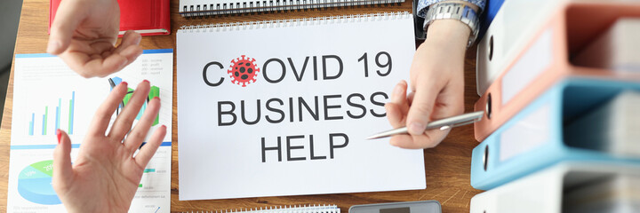 Man and woman discussing business plan coronovirus pandemic. State assistance to small and medium-sized businesses in pandemic concept