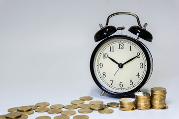 Saving money as a concept. Vintage retro stack of gold coins on the wooden background to represent It's time to do investing for retirement planning.