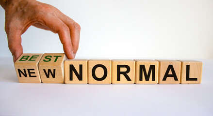New best normal symbol. Hand turns cubes and changes words 'new normal' to 'best normal'. Business...