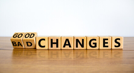 Bad or good changes symbol. Turned wooden cubes and changed words 'bad changes' to 'good changes'. Beautiful wooden table, white background. Business and good changes concept. Copy space.