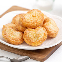 Delicious Palmier butterfly pastry in heart shape for Valentine's day dessert.