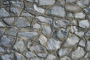 Background wall of large stones.