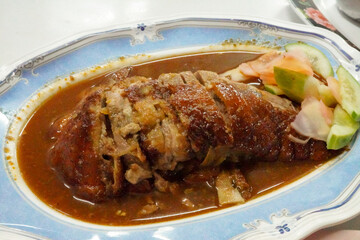 Roast duck chinese cuisine sliced portions on plate. thai streey food