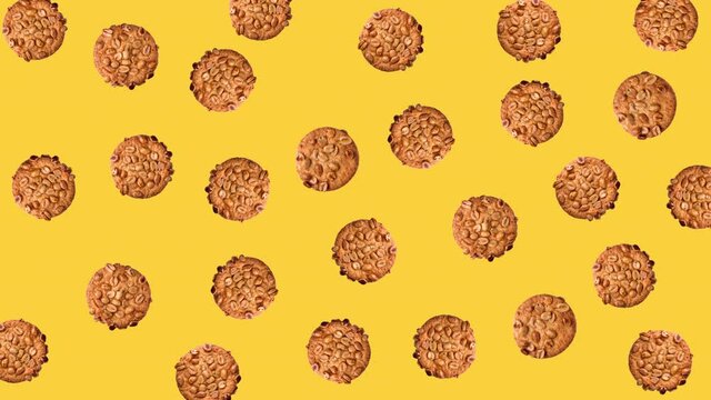 seamless looping pattern animation of peanut cookies that wiggle on a yellow background