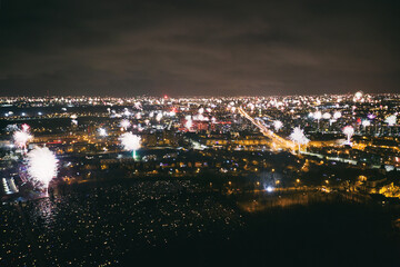 Many fireworks new year celebration in the city. New year, fete, picnic fireworks show. Dabrowa gornicza, silesia poland aerial drone view