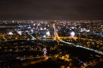 Many fireworks new year celebration in the city. New year, fete, picnic fireworks show. Dabrowa gornicza, silesia poland aerial drone view