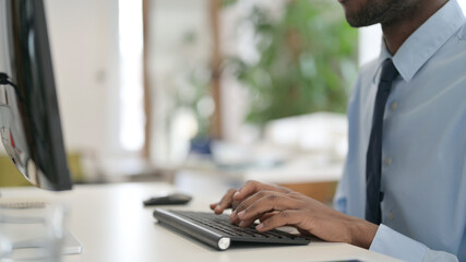 Hands of Businessman Typing on Keyboard, Close Up 