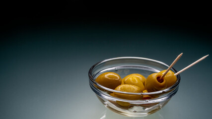 
green olives in glassware stock photo