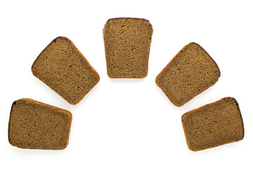 Five slices of brown rye bread isolated on white background. Top view.