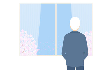 窓から満開の桜を眺める初老の男性