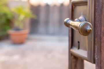 Close.up of a metal latch on an open door