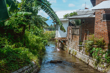 Rural houses and water canal in Indonesia