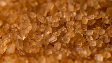 Close-up of brown cane sugar texture. Sweetness
