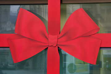 Huge gift wrap at window of bank branch.