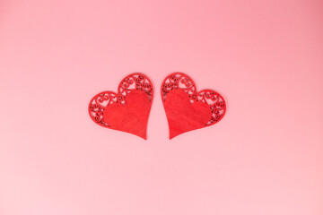 Two hearts on a pink background. Valentine's Day. March 8.