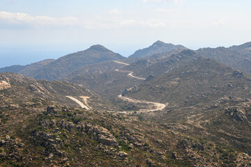 Winding road in the mountainous part of the island of Ios. Cyclades, Greece