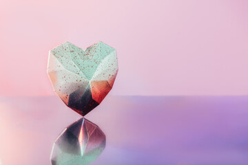 Sparkling geometric heart with reflection on neon pink purple background. Gradient white and pink...